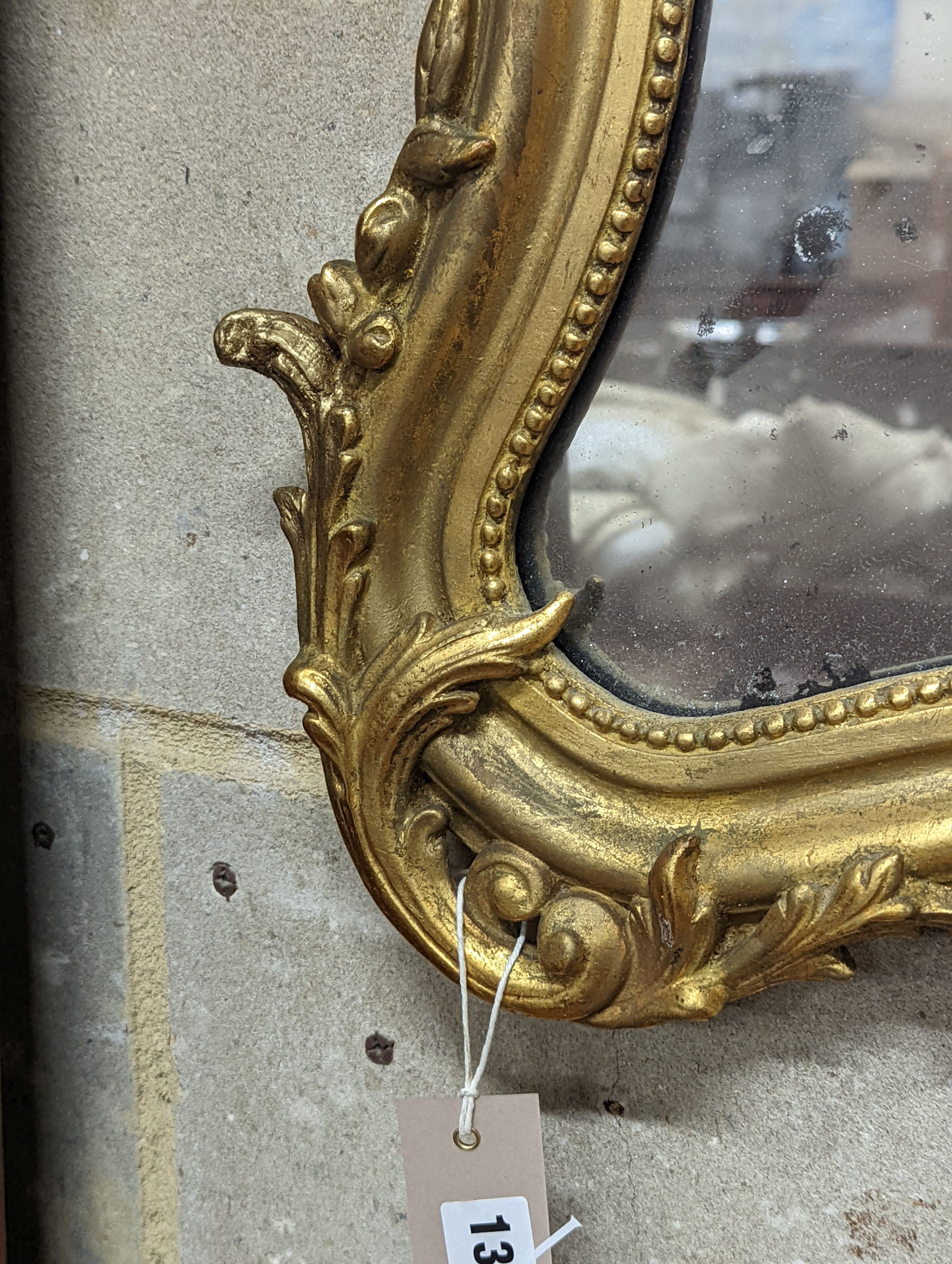 A 19th century French giltwood and gesso cartouche wall mirror, width 51cm, height 66cm